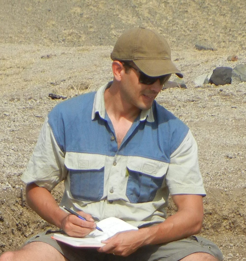 Tyler Faith recording archaeological and paleontological sites in the Lake Victoria region.