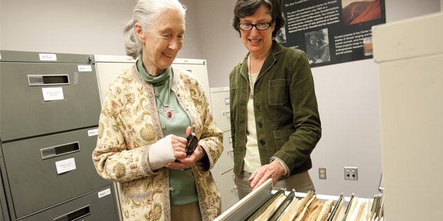 Jane Goodall and Anne Pusey with decades of research data. Photo by Megan Morr. Duke University Press Office.