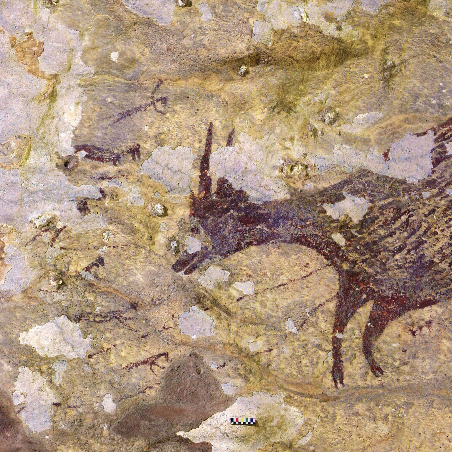 Ice Age art of Sulawesi showing a hunting scene, one of the world's oldest art pieces.